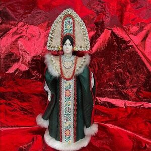 Elegant Green and Red Decorative Doll